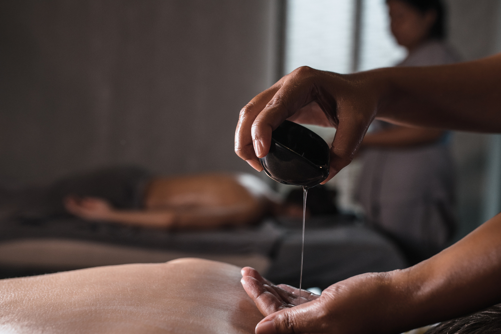 hands of massage therapist massaging back of leg - Pan Thai Massage - Sugar Lang, TX