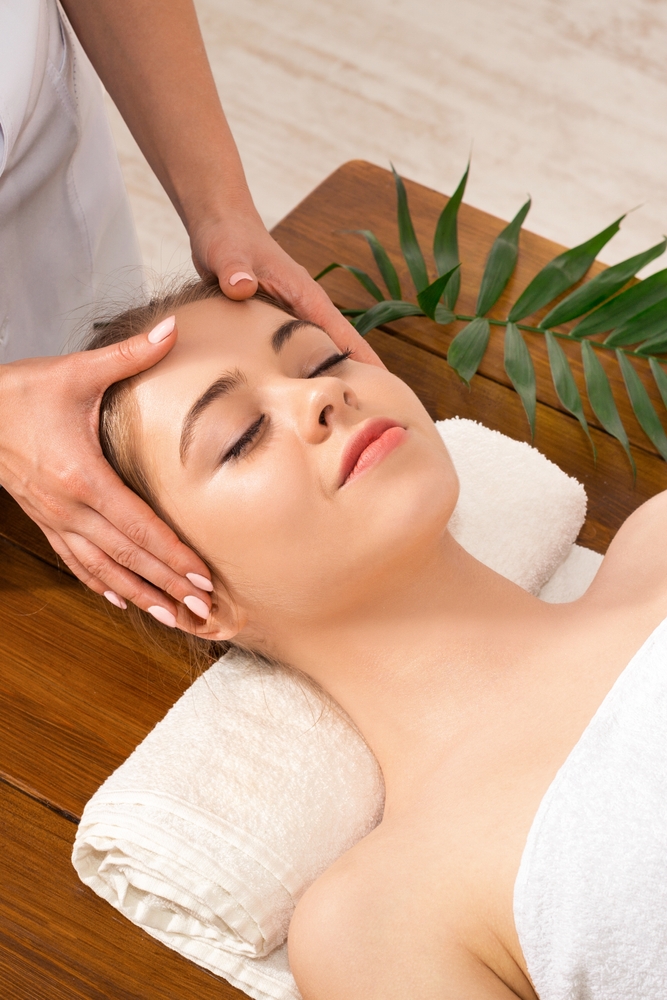 Massage therapist doing thai massage stretch for arms on customer - Pan Thai Massage - Sugar Land, TX